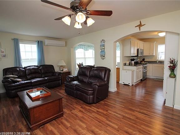 Open flow into kitchen and sitting/office area.