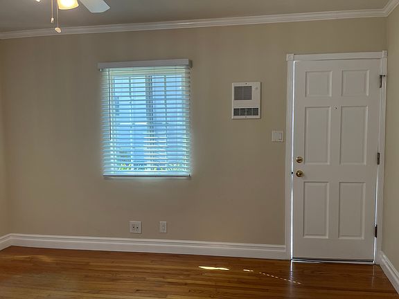 FRONT DOOR AND WEST WALL