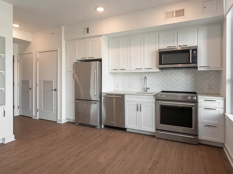 Kitchen with Stainless Steel Appliances and Quartz Countertops