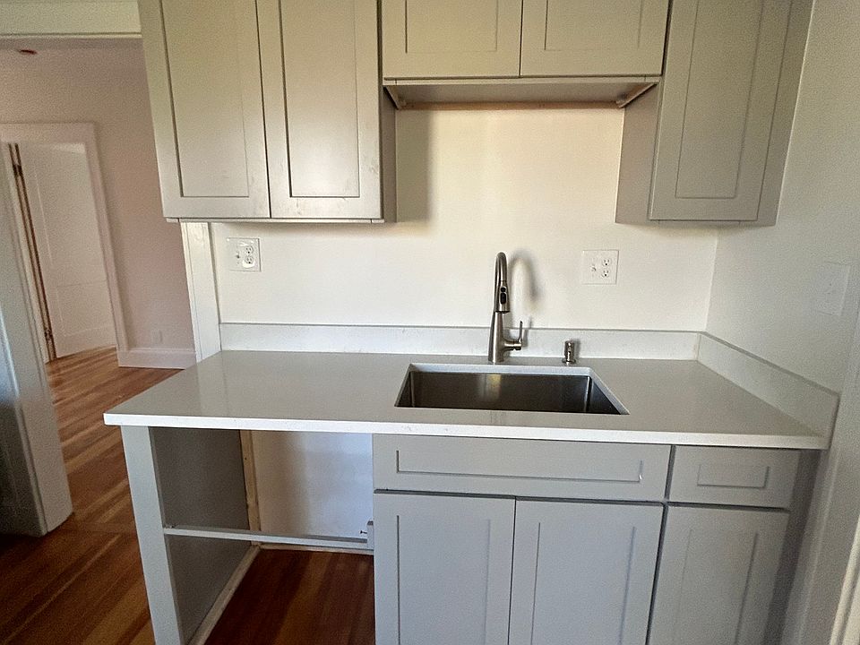 Kitchen sink area with Cabinets