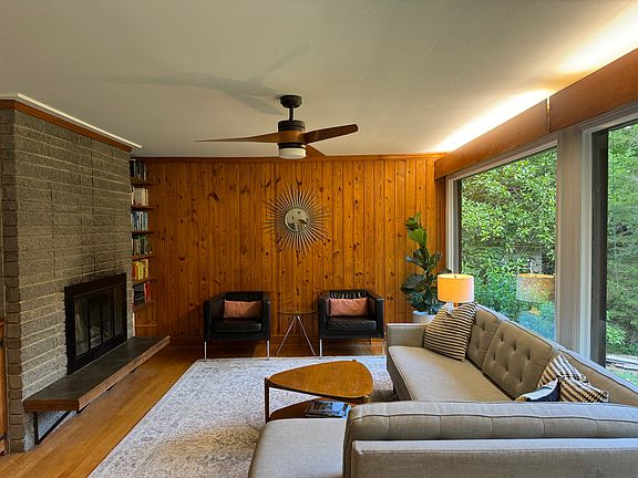 Living room with wood burning fire place