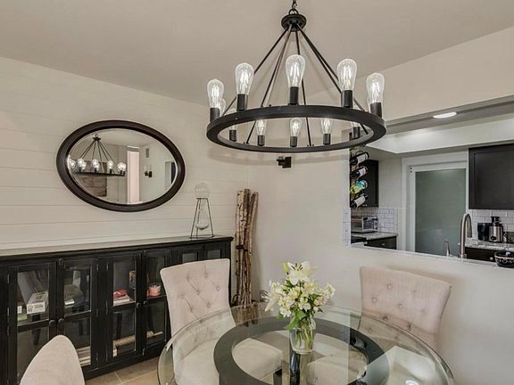 Dining open to kitchen with frosted barn door to laundry (2nd floor)
