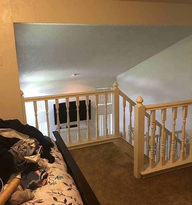 Master bedroom overlooks he living area