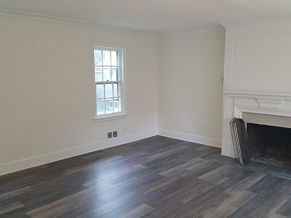 Living room with fireplace shown.