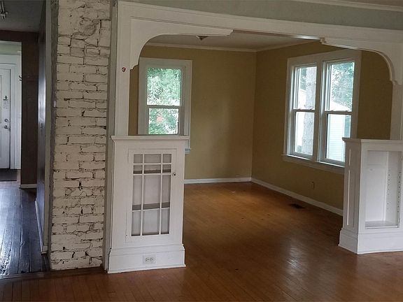 View from front, looking toward the back. Check out the neat detail of brick and old built-ins!