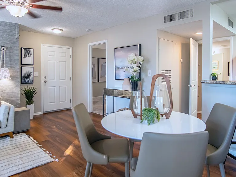 Delight in the included ceiling fans and sleek wood-style flooring throughout our warm, inviting living areas.