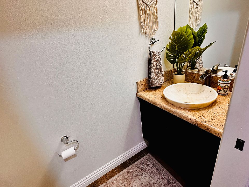 half bathroom located downstairs level