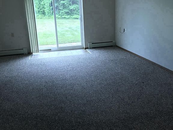 Living area with new sliding glass door to patio.