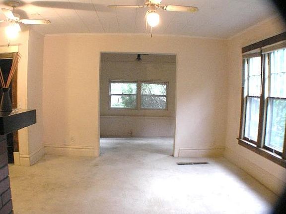 Living room with bonus alcove, large windows, electric firep