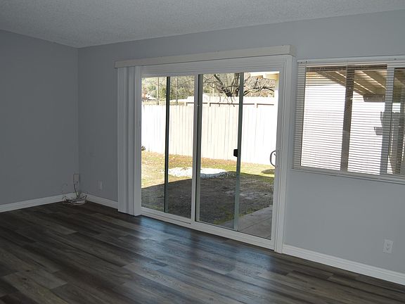Living room area with sliding door to small yard