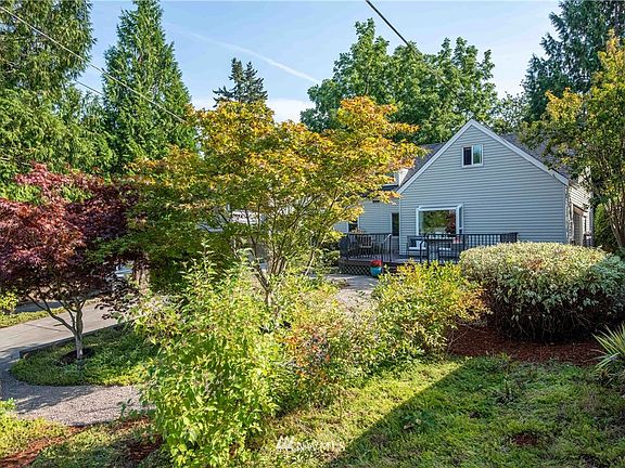 Mature, low water landscaping keeps the home feeling private.