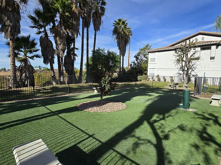 Dog-friendly fun at The Hills at Quail Run! Shaded play area, benches, and a water station for your pup's comfort.