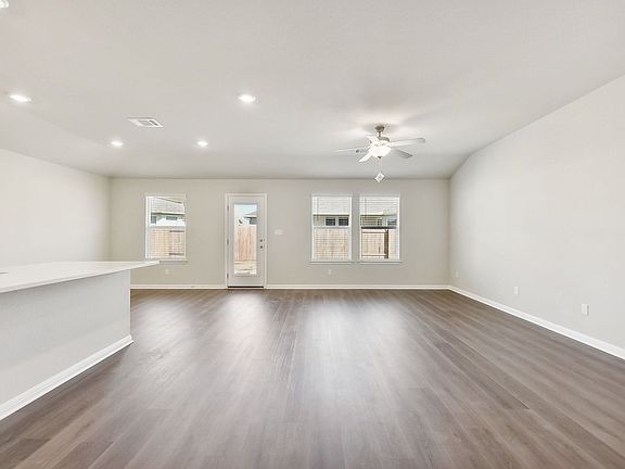The open concept kitchen, living, and dining areas are great for entertaining.