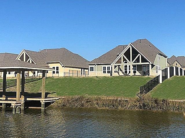 WATER VIEW OF THIS BEAUTIFUL NEW CONSTRUCTION COMPLETE WITH 40' BOATHOUSE AND DIRECT ACCESS TO CLEAR LAKE AND GALVESTON BAY. ENJOY SOARING CEILINGS, BEAUTIFUL FINISHES AND THE COMFORT OF EXCELLENT CONSTRUCTION DETAILS.
