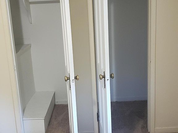 View inside his and her closets within the master bedroom