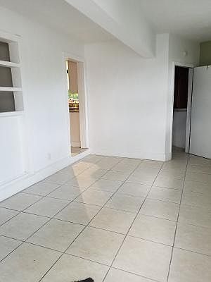 Huge Foyer upon entering home; perfect HOME OFFICE! Open door at back of picture is the laundry room.