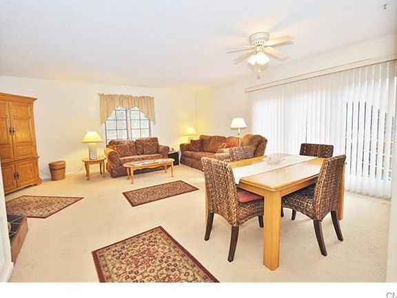 Dining area with sliders leading to private deck.