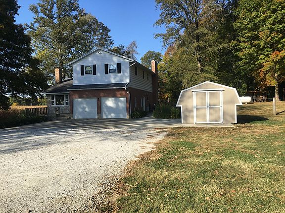 Shows the garden shed (with lights and recepts), and the walk-thru door from the garage (right side, along the sidewalk).