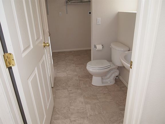 Large downstairs bathroom and storage room with W/D hookups