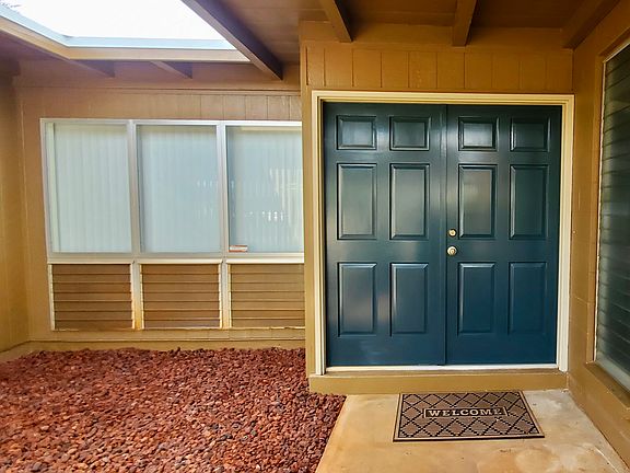 Freshly Painted Front Doors and Atrium with new gravel