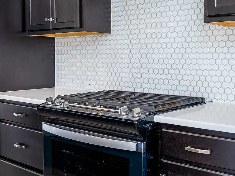 Chef inspired kitchen with oversized island, high end stainless steel appliances and Samsung Smart Hub Fridge