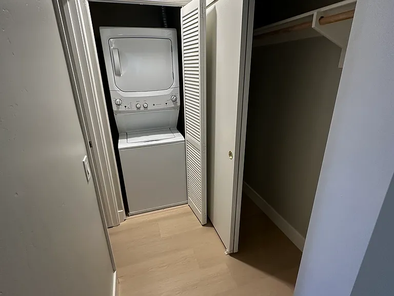 Washer and Dryer Straight Ahead and Deep Closet Right Off the Bedroom. To the left of the W/D is the Primary Bath