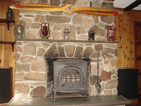Fantastic Fieldstone mantle Surrounds the Woodburning Stove