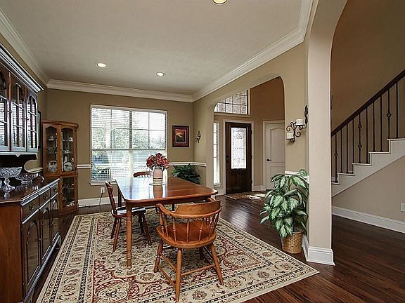 Another Photo Of Formal Dining*Note The Elegant Staircase With Metal Spindles.