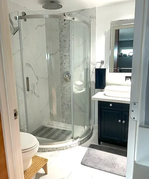 rainfall shower in marble bathroom