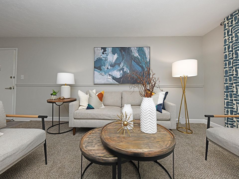 Spacious living room with carpet