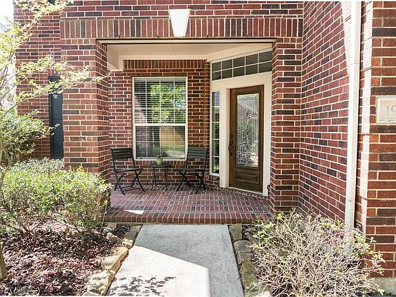 Beautiful covered front entryway with room to relax and enjoy the neighborhood.