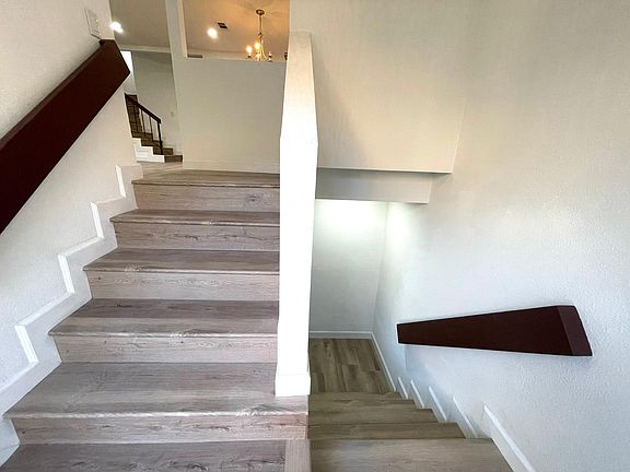 Entry stairs leading to living room and garage