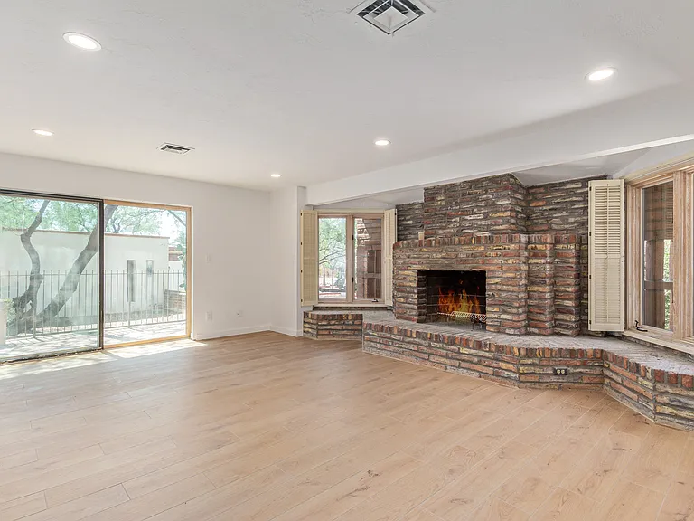 PRIMARY WITH SLIDING GLASS DOOR LEADING TO THE SIDE PATIO AND BACKYARD