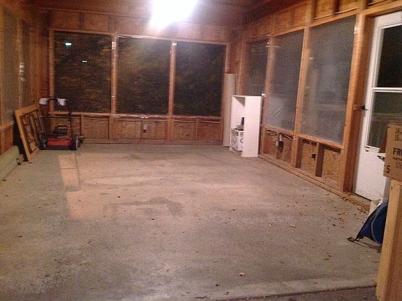 Screened area at the back of the garage