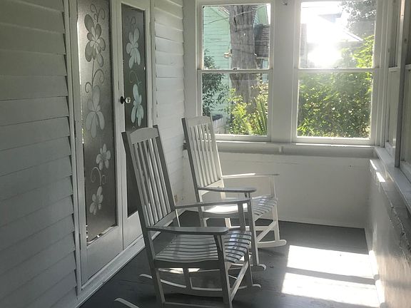 Right side of enclosed front porch