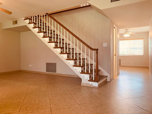 Large living room with stairs to second-floor bedrooms