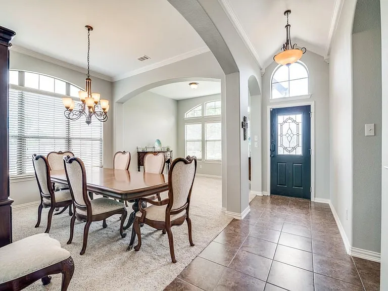 Front entry with dining area or space for a game room or home office.