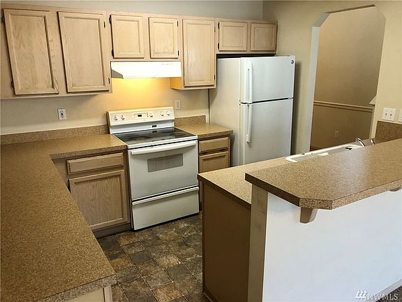 Kitchen with plenty of storage and open to living room
