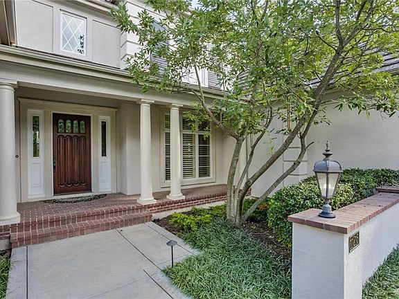 Gorgeous front porch and hand crafted, custom front door.