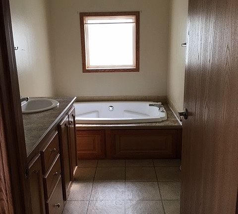 Oversized master bathroom with stand in shower and seperate
