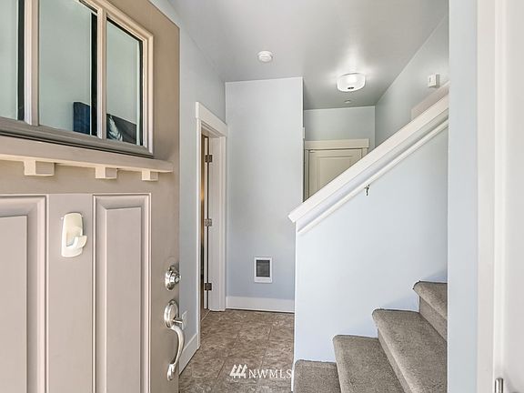 The inviting entry features new vinyl and tons of storage in not one, but 2 closets.