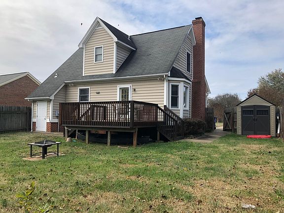 Fenced in back yard, outdoor storage closet, storage shed, deck and fire pit.