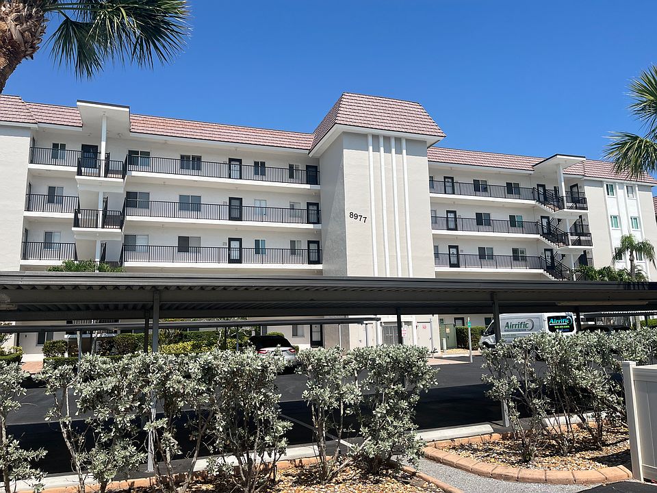 Top Floor Corner Unit/ 1 Carport Space and plenty of guest parking available. Directly across from the beach