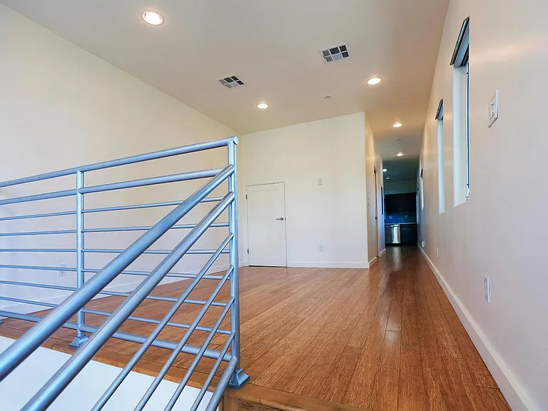 Living Room with Hallway to Guest Bathroom and Kitchen
