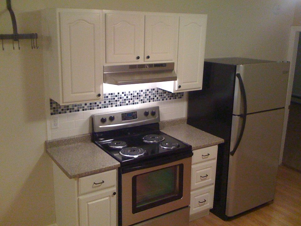 Kitchen Stove, Fridge, and Pot Hanger