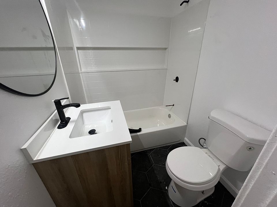 Fully flipped bathroom. New tile floors, new toilet, new vanity, new shower surround/tub/fixtures. Efficient color changing light + 800 CFM high efficiency fan.