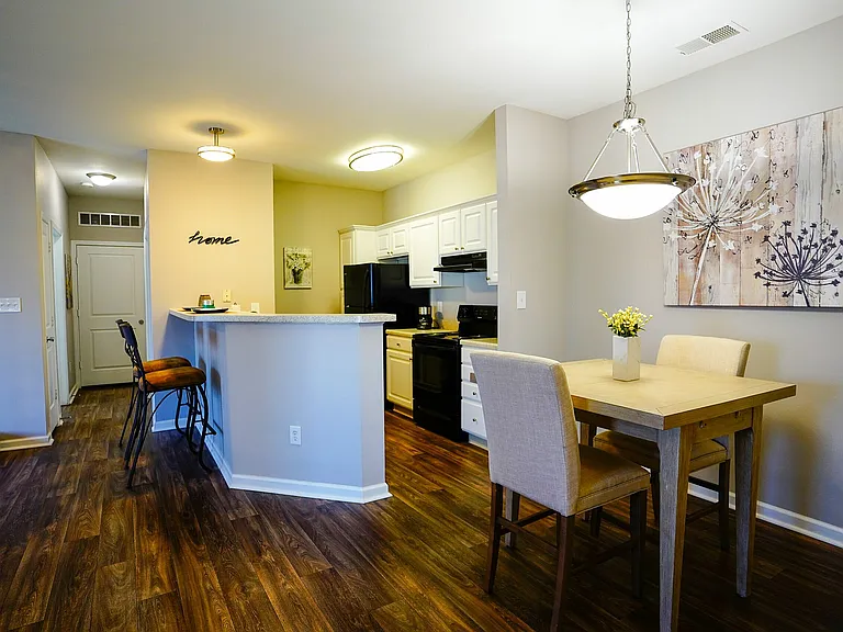 Discover an open-concept layout where the kitchen meets the dining room. A bright breakfast bar/half wall creates a natural separation while keeping the space connected.