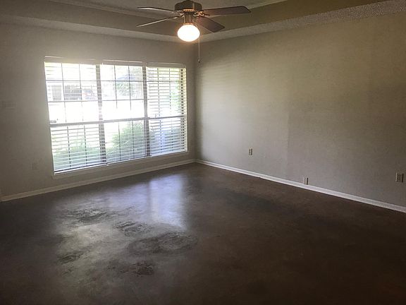 Den with stained concrete floor