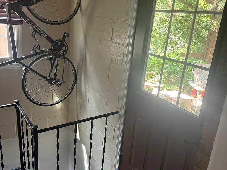 Entrance from inside with available road bike hook.