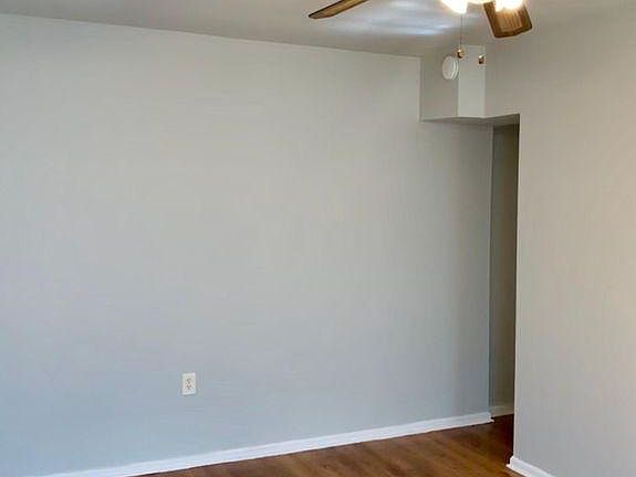 Living area with door to bedroom
